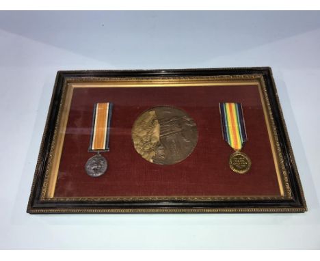A framed, mounted first World War pair of medals, and a death plaque to William Henry Dunkeld