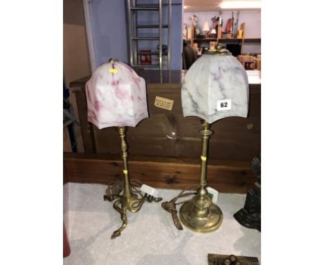 An Art Nouveau brass table lamp and an Edwardian brass table lamp, with shades