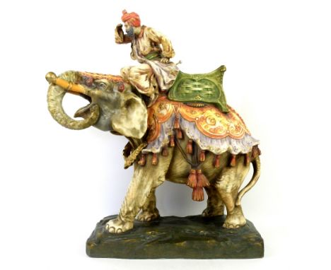 A very large Austrian Imperial Amphora, Bohemia polychrome ceramic elephant and rider group, circa 1905-10. Modelled with an 