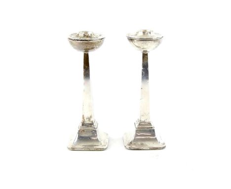 Art Deco silver pair of candlesticks, on square filled bases with tapering columns, by J W Tiptaft &amp; Son Ltd , Birmingham