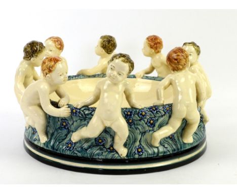 ‘Schale Kinderreigen’designed by Wilhelm Süs (1861-1933), circa 1910, majolica centrepiece modelled as eight naked putto form