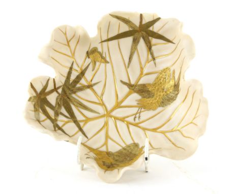 Royal Worcester aesthetic movement bowl in the form of a leaf, decorated in gilt with bamboo, two cranes and a butterfly, the