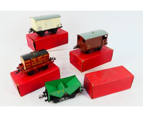 Hornby - Four boxed O gauge items of rolling stock. Lot consists of #42150 Flat Truck with container; #42170 Goods Brake Van;