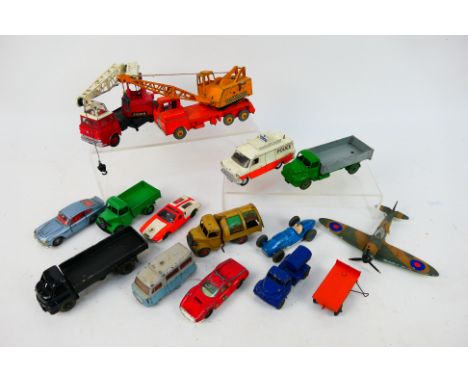 Dinky Toys - 14 unboxed playworn diecast vehicles form Dinky Toys. Lot includes Dinky #532 Leyland Comet with hinged tailboar