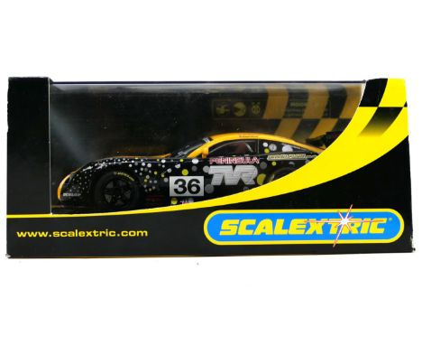 Scalextric - A boxed Scalextric racing vehicle - The #C2591 TVR Tuscan 400R Peninsula comes in perspex box with outer box. Pe