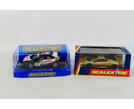 Scalextric - 2 x boxed Scalextric vehicles - Lot includes a #C2083 Jaguar XJ 220. A #C2912 Seat Leon. Perspex boxes appear go