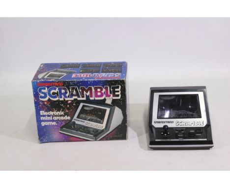 Grandstand - A boxed #11253 Grandstand Scramble game. Game doesn't come with batteries and is untested. Box appears good with
