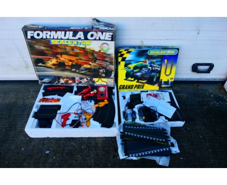 Scalextric - Formula One - Silverstone - Sport. Two boxed Scalextric sets and a bag of additional track. Formula One Silverst