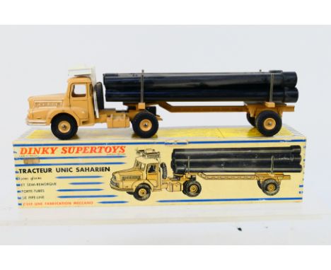 French Dinky Toys - A boxed French Dinky Toys #893 Tractuer Unic Saharien. The model in beige with beige trailer, white plast