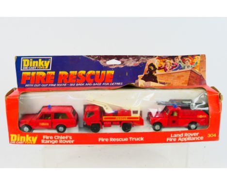 Dinky Toys - A boxed Dinky Toys #304 'Fire Rescue Set' The three piece set includes Fire Chief's Range Rover, Fire Rescue Tru