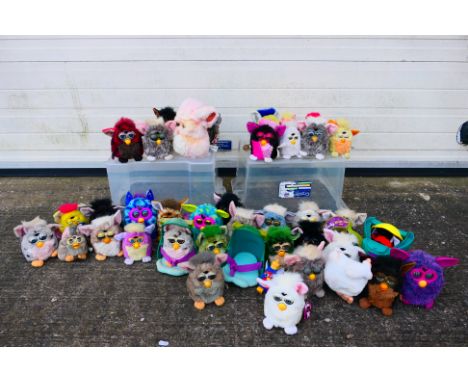 Hasbro - Tiger Electronics - A unboxed collection of over 30 Furbys. Lot includes a myriad of characters, with some having sw