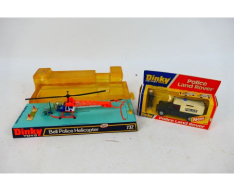 Dinky Toys - Two boxed Dinky Toys police vehicles. Lot consists of #277 Police Land Rover; together with #732 Bell Police Hel