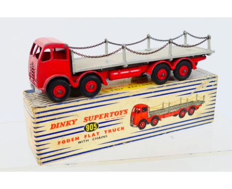 Dinky Toys - A boxed Dinky Toys #905 Foden Flat Truck (2nd Type) with Chains. The model with red cab, chassis and grey back w