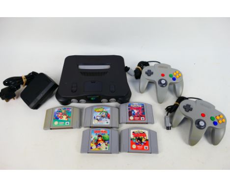 Nintendo - Nintendo 64 - N64. An unboxed N64 #NUS-001(EUR) with 2 Nintendo pads / PSU /  and Five game cartridges: Pokemon St
