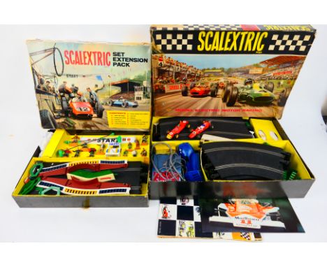 Scalextric - A boxed Scalextric Set 50 with a boxed Scalextric Set Extension Pack HP1. Set 50 contains a quantity of track, 2