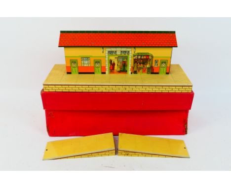 Hornby - A boxed Hornby O gauge #3 Station. The tinplate station comes with its two platform ramps, and appears to be in Very