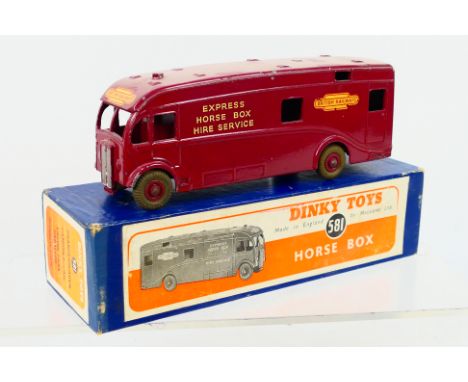Dinky Toys - A boxed Dinky Toys #581 Horse Box 'British Railways'. The model in maroon with maroon hubs, has some wear to dec