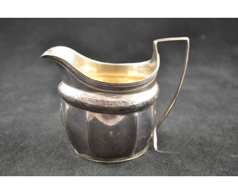 A late Georgian engraved silver helmet shaped cream jug, London 1806, monogram to front - approx weight 89g/2.8 troy ozCONDIT