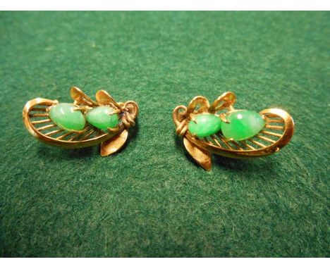 A pair of yellow metal earrings, each set with two teardrop shaped jade cabochons - approx gross weight 3.3g.CONDITION REPORT