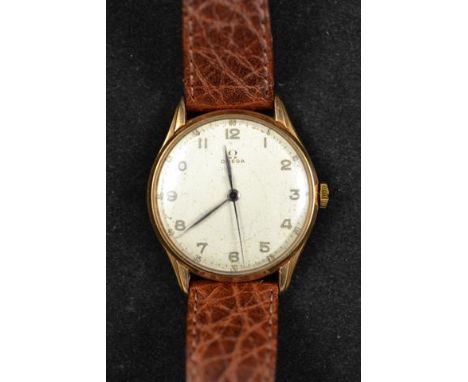 A gentleman's Omega yellow metal (tests as 18ct gold) manual wind wristwatch, dial with arabic numerals and outer seconds mar