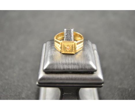 An 18ct gold signet ring with central gypsy set diamond and Greek key design to shoulders - size R, approx gross weight 6g.CO