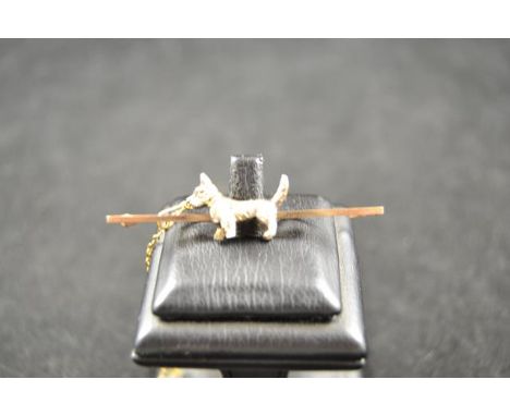 A 9ct gold bar brooch mounted with Highland terrier, in Wilkinson case - approx weight 5.5g CONDITION REPORTgood condition