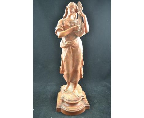 A terracotta figure of a woman playing a lute, inscribed to base Mignon de Robert - H48cmCONDITION REPORTgood condition