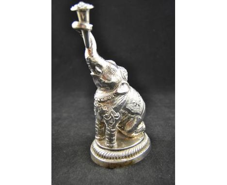An Indian white metal rosewater sprinkler in the form of a kneeling elephant, late 19th/20th Century - H21cm.CONDITION REPORT