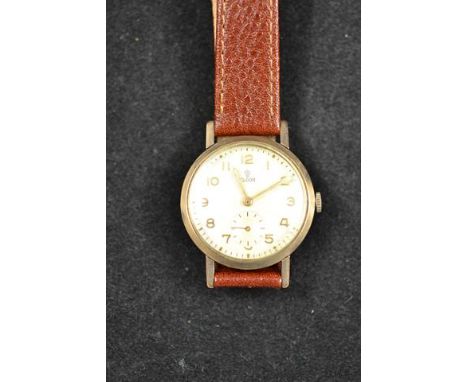 A gentleman's Tudor yellow metal (tests as 9ct gold) cased wristwatch, dial with arabic numerals and subsidiary seconds dial,