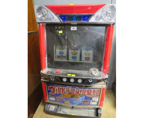 A JAPANESE ELECTRONIC REEL TABLE TOP FRUIT MACHINE, with glazed top front panel, set up for token operation, H 81 cm, W 47.5 