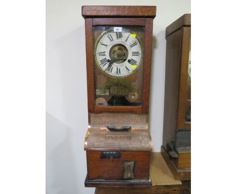 A NATIONAL TIME RECORDER OAK CASED CLOCKING IN CLOCK, with visible clock movement, H 88 cm 