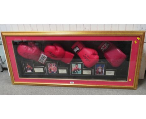 FOUR FRAMED AMERICAN HEAVYWEIGHT WORLD CHAMPION SIGNED BOXING GLOVES, to include Joe Frazier, George Foreman, Larry Holmes an