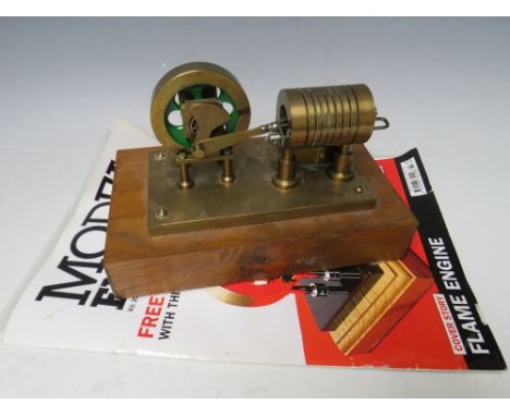 A FLAME / VACUUM ENGINE ON WOODEN PLINTH, with build plans 