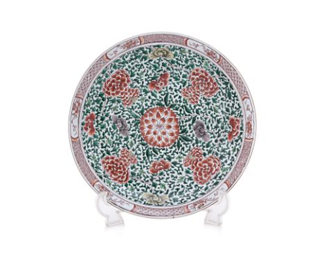 A LARGE FAMILLE VERTE FLORAL PORCELAIN DISH Decorated with iron red, yellow and other flowerheads within scrolling foliage, w