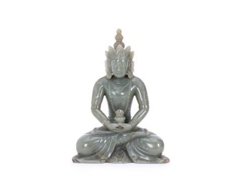 A CARVED JADE FIGURE OF AMITAYUS BUDDHA Seated, with legs in double lotus position, the hands together holding a vase, with d