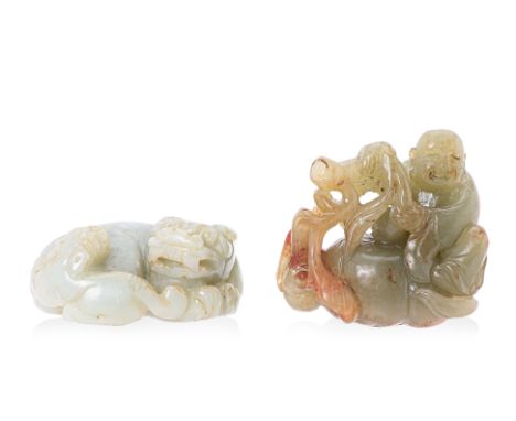 TWO JADE CARVINGS
Comprising: a recumbent mythical beast with its cub; and a figure of a monk with an oversized pumpkin
(2 to
