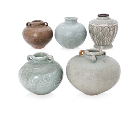 A GROUP OF FIVE CHINESE CELADON JARS
Song to Ming types. One Yaozhou ware, ovoid form with brass band to mouth, lotus petal b