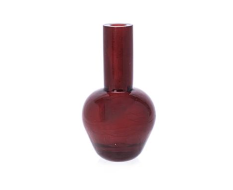 A MINIATURE RED PEKING GLASS BOTTLE VASE With straight neck and high shouldered spherical body, recessed base, wood stand wit