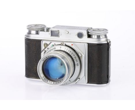 A Voigtlander Prominent 35mm Rangefinder Camera, chrome, serial no. B3382, body G, RF patch bright &amp; clear, shutter worki