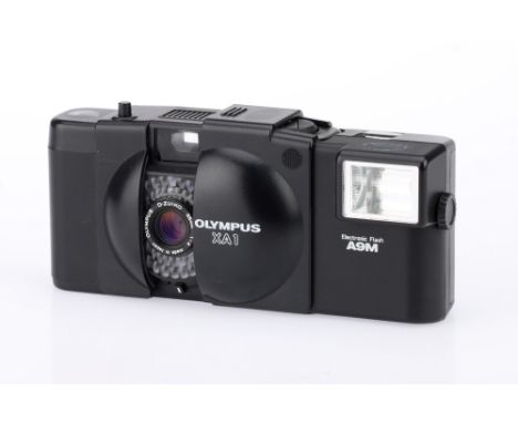 An Olympus XA1 35mm Compact Camera, black, body G, shutter working, flash working, optics G, some light haze present,