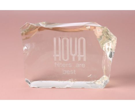 A Hoya Retail Display Block glass, irregular shape, inscribed HOYA FILTERS ARE BEST, size 20cm x 15cm x 10cm, very heavy item