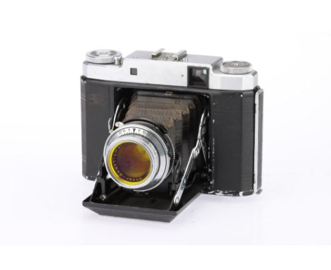 A Zeiss Ikon Super Ikonta Medium Format Rangefinder Camera, chrome, body G, shutter working but linkage requires attention, R