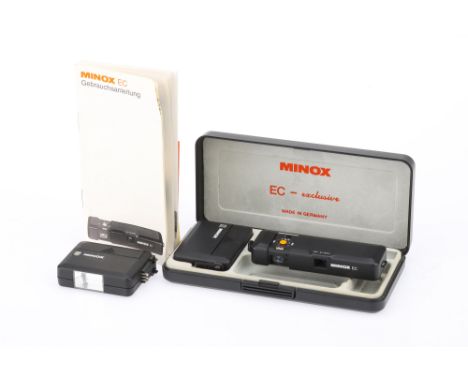 A Minox EC Subminiature Camera, black, body G-VG, shutter working, in maker's display case with two flash units, one working 