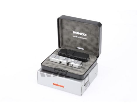 A Minox CLX Sub-Miniature Camera 1998, chrome, serial no.1122, commemorating 60 years of Minox, engraved with line drawings o