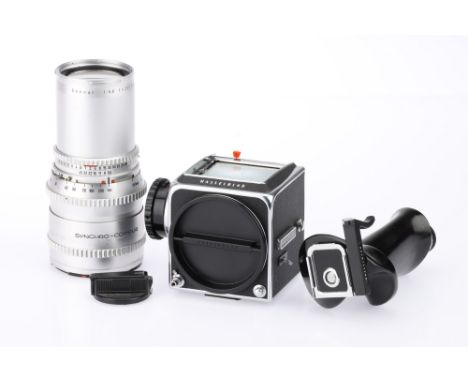 A Hasselblad 500cm Medium Format Camera Body, chrome, serial no. RV 1255833, c.1981, body G, wind mechanism jammed, inner res