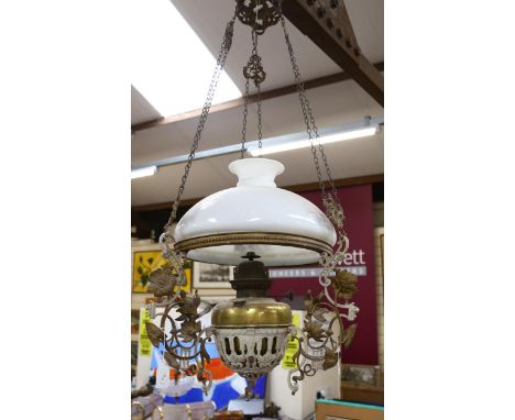 A large early 20th century Art Nouveau hanging oil lamp, with milk glass shade, height 100cm 