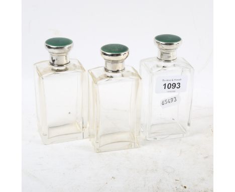 A set of George V toilet bottles, with silver and green enamel mounts, London 1931 
