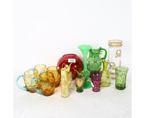 A group of coloured glassware, including a set of 4 amber mugs, enamel decorated jugs, French amethyst vase etc 