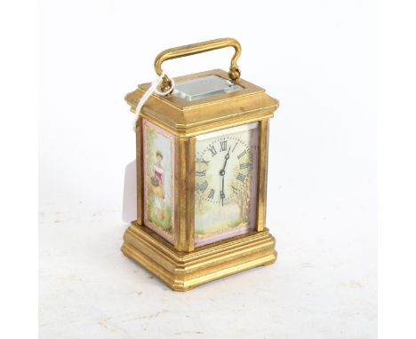 A miniature reproduction brass carriage clock, height 7.5cm not including handle 