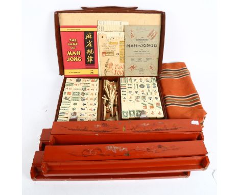 A Chad Valley Mahjong bone and bamboo set, cased with stands 